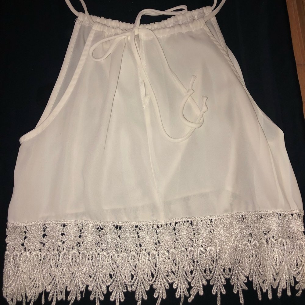 White tank top with fringe on bottom